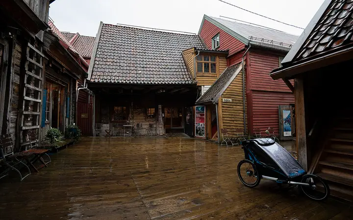 Wooden walkway between old timber buildings in the passages behind Bryggen, Bergen