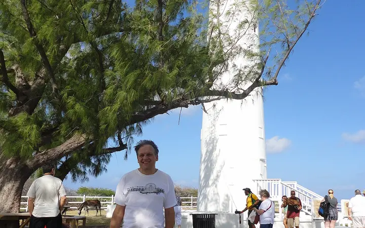 White cast-iron Grand Turk Lighthouse among casuarina trees