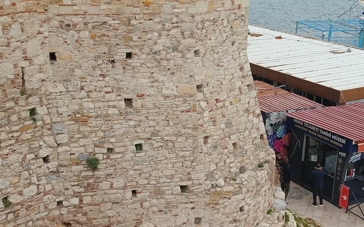 Castle tower on Pigeon Island with Kuşadası in the background