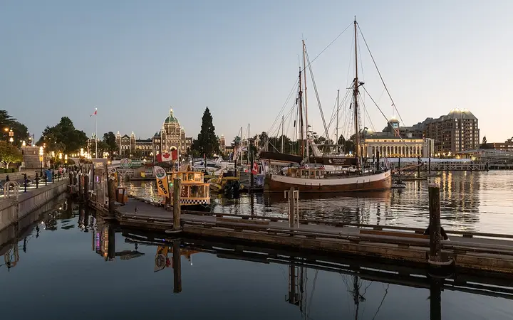 Victoria Inner Harbour marina and the BC Parliament Buildings at dusk
