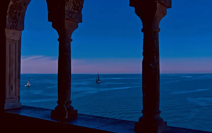 Sea view framed by the Gothic arches of the Church of San Pietro, Portovenere