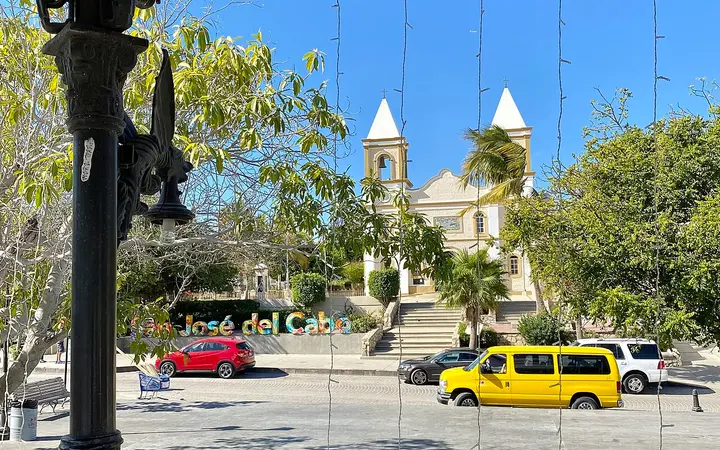 Twin-towered church of San José del Cabo seen across the main plaza from the bandstand