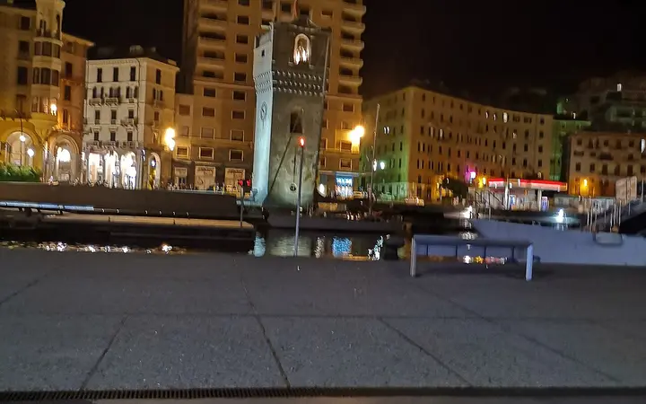 The Torre Leon Pancaldo (Torretta) lit at night at Savona's old harbour