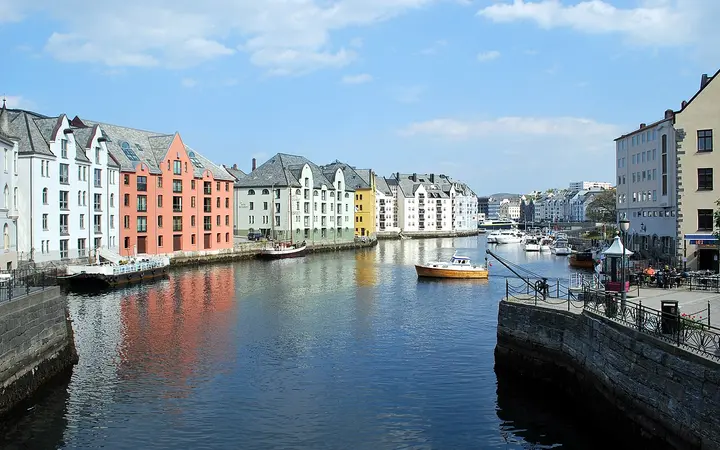 Pastel-coloured warehouses along the Brosundet canal in Ålesund