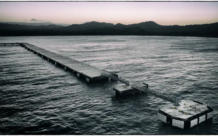 Amber Cove cruise pier extending into the Bay of Maimón at dusk