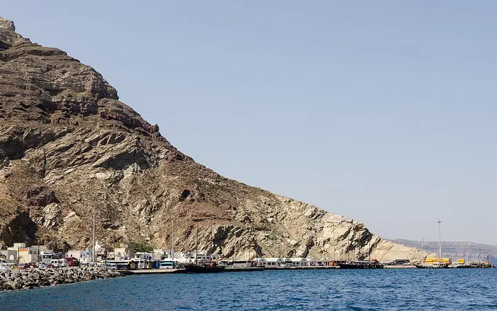 Athinios port at the foot of the crater rim
