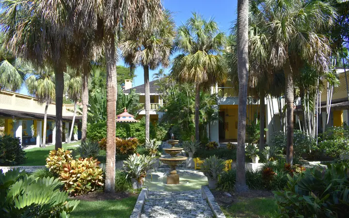 Palm-shaded courtyard with a fountain at Bonnet House in Fort Lauderdale