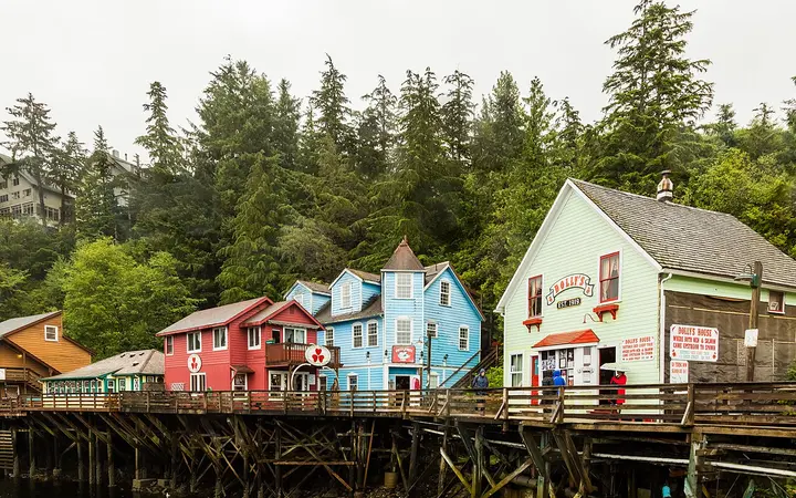 Brightly painted wooden buildings on pilings along historic Creek Street in Ketchikan