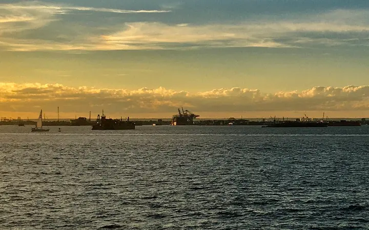 Cape Liberty Cruise Port on the Bayonne peninsula seen across Upper New York Bay at sunset