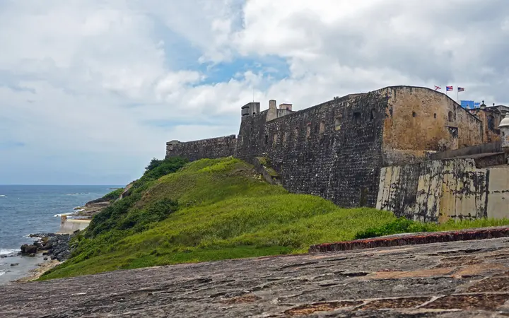 Panoramic view of the stone walls and bastions of Castillo San Cristóbal above the Atlantic in Old San Juan