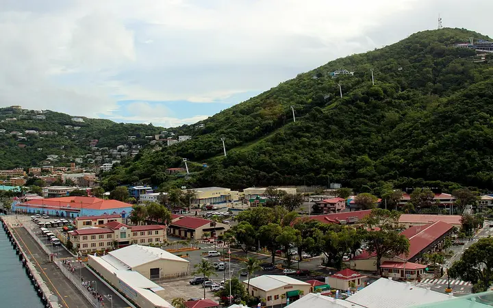 The WICO cruise pier at Havensight with taxis lined up and the Paradise Point Skyride towers on the hill