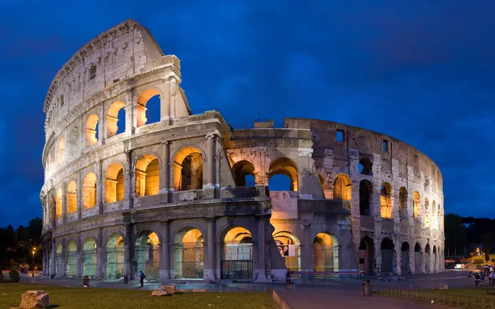 The Colosseum in Rome lit up at dusk