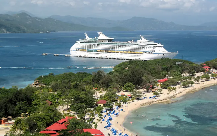 View from the Dragon's Breath zip line platform over Labadee bay towards a docked Royal Caribbean ship