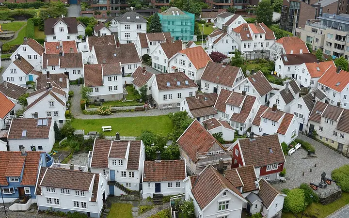 White wooden houses with red-tiled roofs in Gamle Stavanger seen from above
