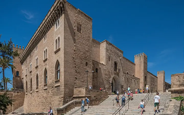 Stone facade and entrance steps of the Royal Palace of La Almudaina in Palma