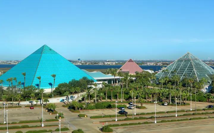 The blue aquarium pyramid, pink discovery pyramid and glass rainforest pyramid at Moody Gardens, Galveston