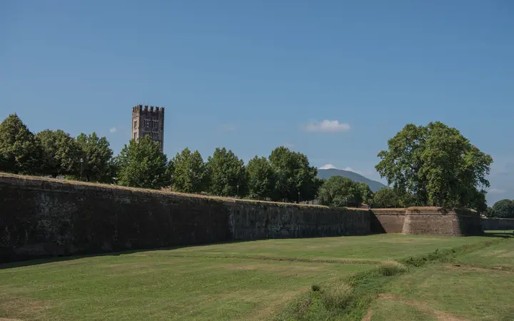 Grassy rampart and brick bastion of the walls of Lucca