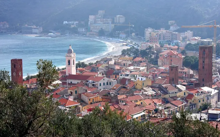 Panorama of Noli's rooftops, bell towers and bay