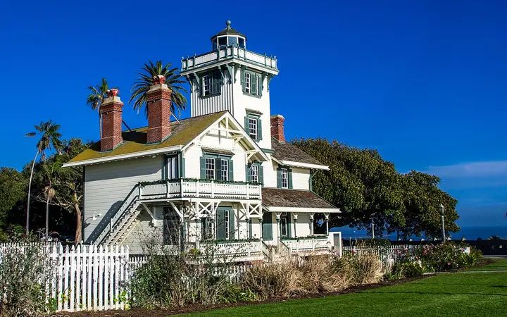Point Fermin Lighthouse, a Victorian wooden lighthouse among palms in San Pedro