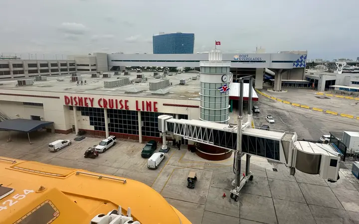 Port Everglades Cruise Terminal 4 with Disney Cruise Line signage and its passenger boarding bridge