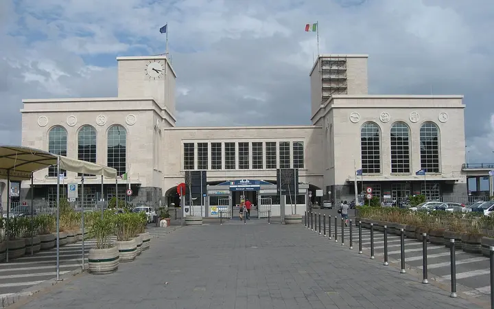 Front of the Stazione Marittima cruise terminal building in Naples, with its two clock towers