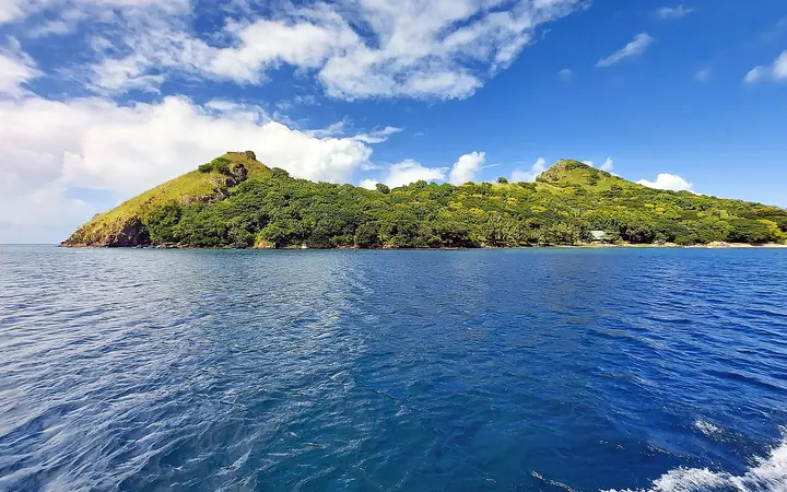 Green, hilly Pigeon Island seen from the sea off Rodney Bay, Saint Lucia