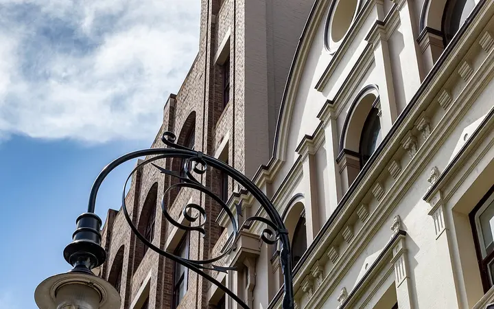 Historic sandstone facade and heritage street lamp on George Street in The Rocks