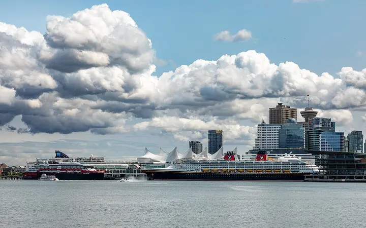 Cruise ships berthed at Canada Place with the downtown Vancouver skyline
