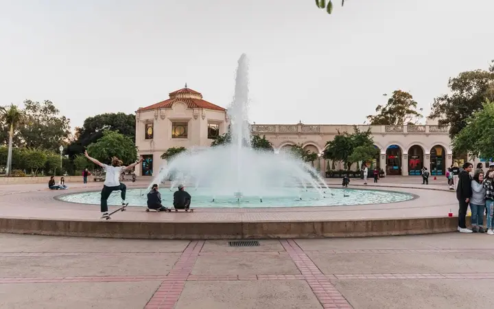 Bea Evenson Fountain in the plaza at Balboa Park, San Diego, with the Spanish-style museum buildings around it