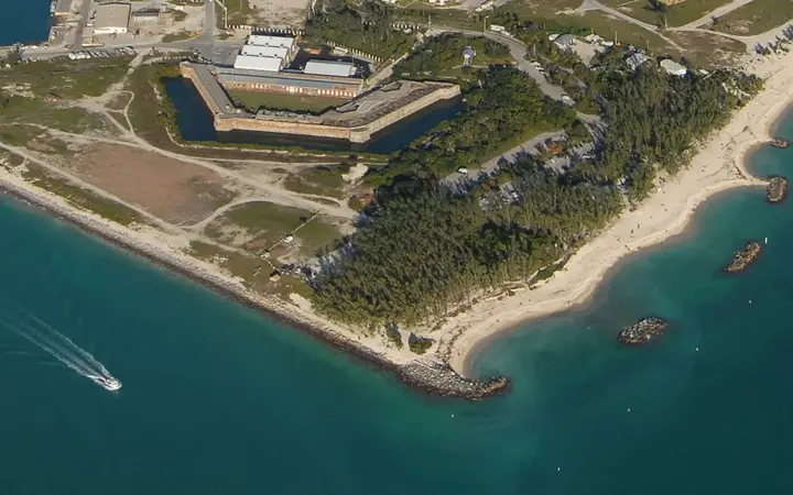 Aerial view of Fort Zachary Taylor and its green park, beach and turquoise water at the southern tip of Key West