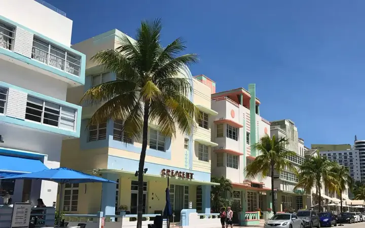 Pastel Art Deco hotels and palm trees along Ocean Drive in South Beach