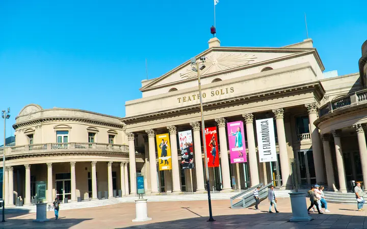 Neoclassical columned façade of the Teatro Solís in Montevideo on a sunny day