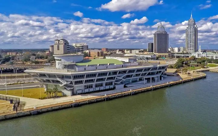 GulfQuest National Maritime Museum of the Gulf of Mexico on the Mobile River waterfront with the downtown skyline
