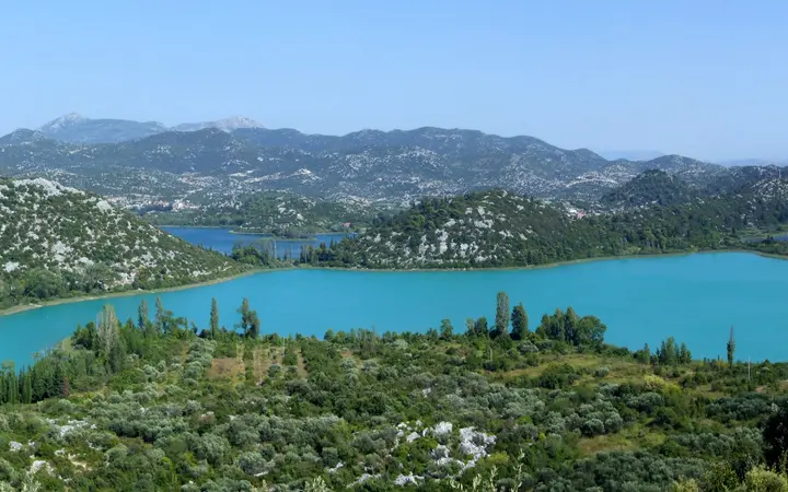 Panorama of the Baćina Lakes surrounded by green hills